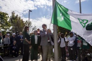 The Franco Ontarian flag being raised