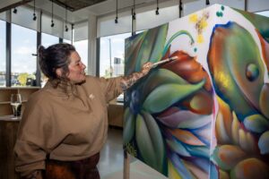 A painter showing her work