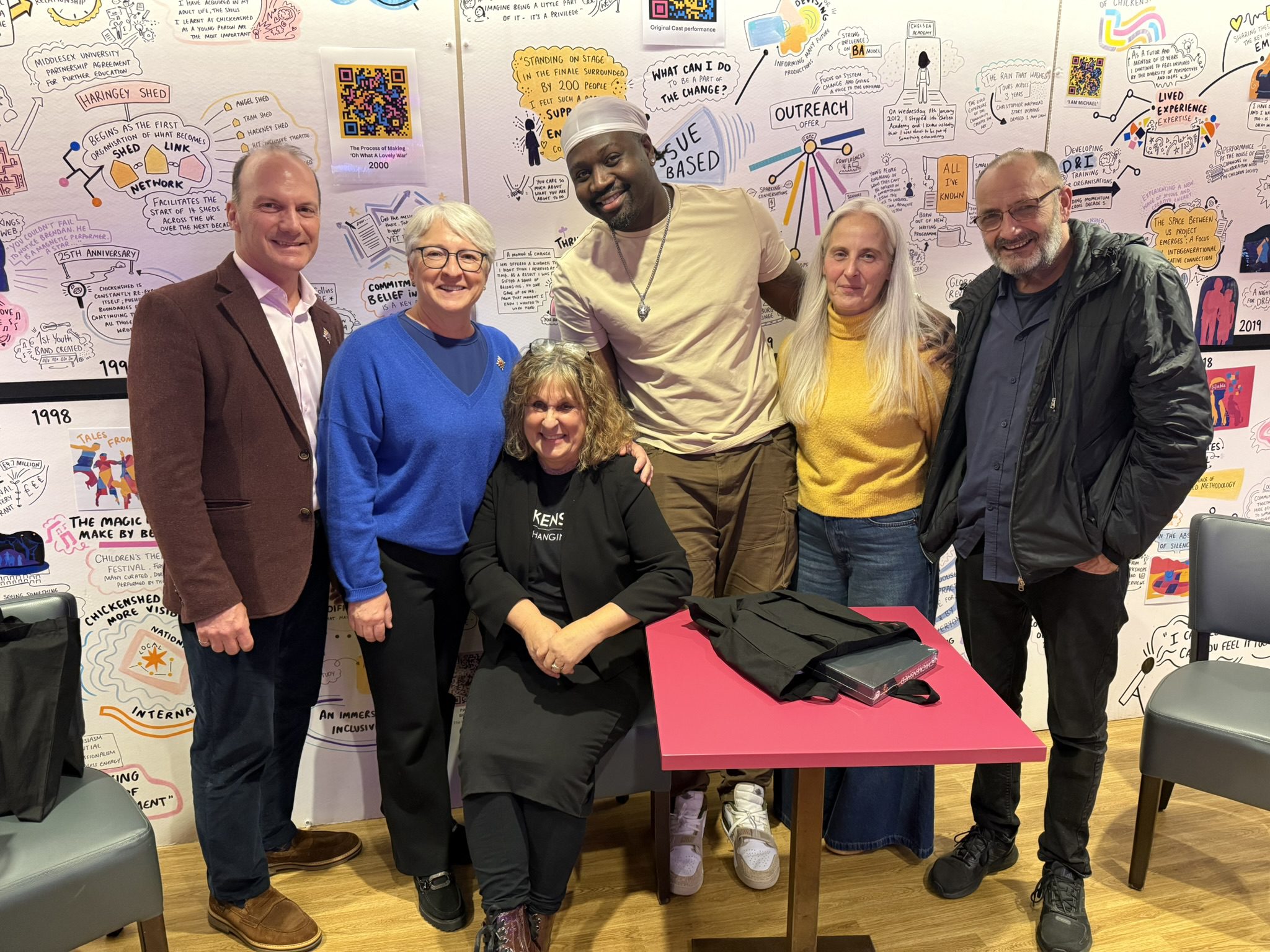 The Honourable Edith Dumont posing with a group of people at Chickenshed Theatre